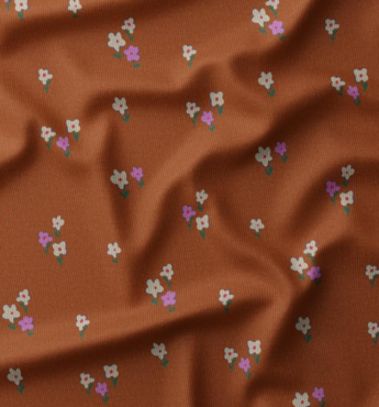 coupon 135/ Ribfluweel - Roest met kleine bloem